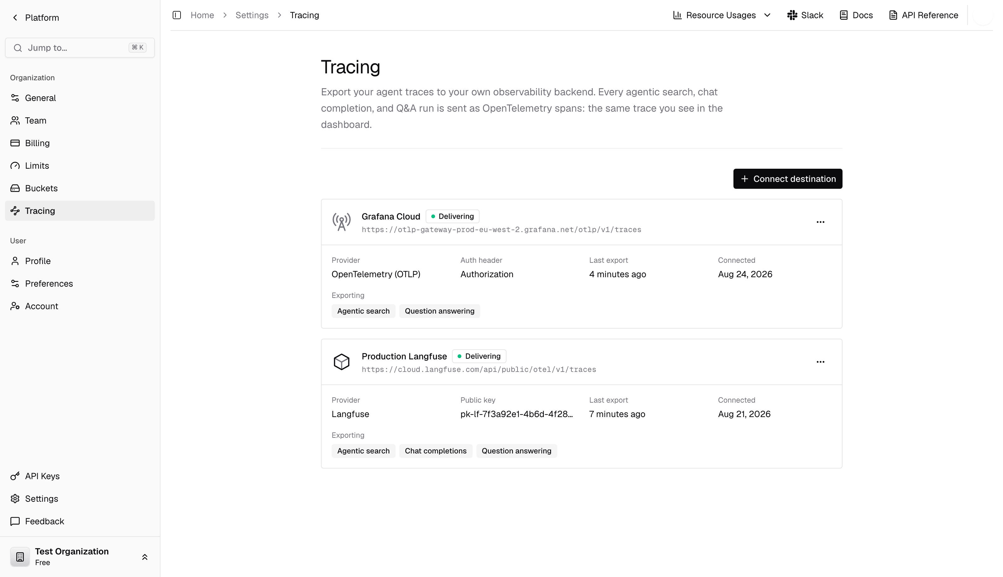 The Tracing settings page in the dashboard, showing a Langfuse and an OTLP destination, both with a green Delivering status.